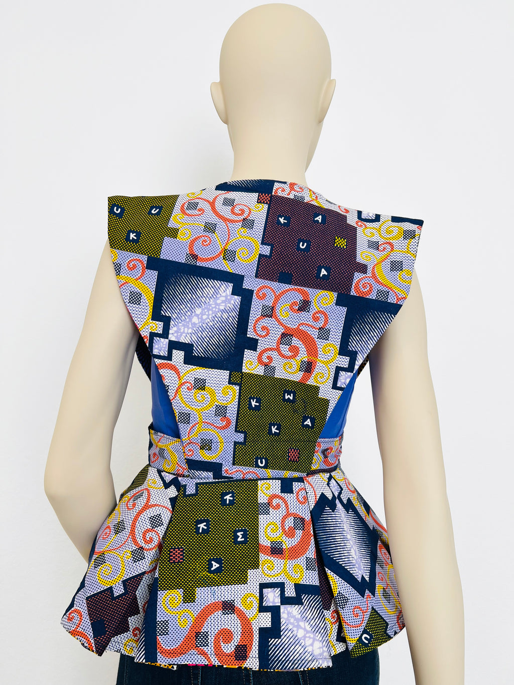 All-Season Reversible Peplum Vest